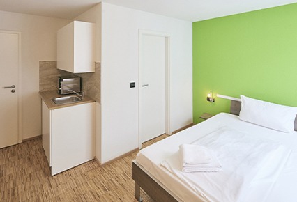 hotel-merlin-einzelzimmer-komfort-kueche hotel merlin einzelzimmer komfort mit kueche